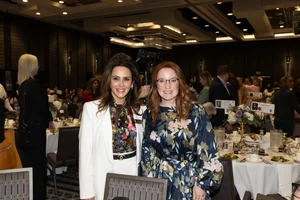 2 women smiling.