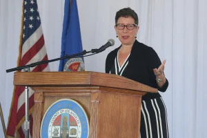 speaker at the podium at the 2019 John Anson awards ceremony.