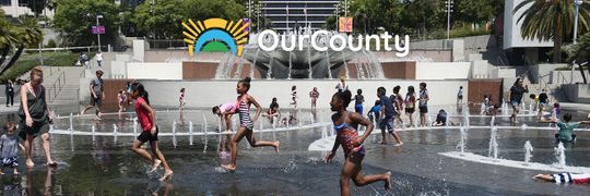 OurCounty banner image of kids running on the fountains.