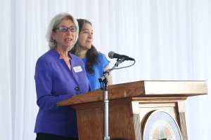 speaker at the podium at the 2019 John Anson awards ceremony.