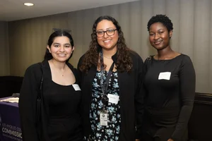 3 women smiling.