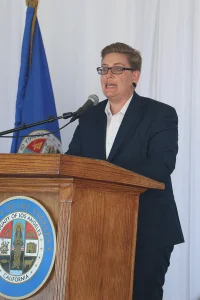 speaker at the podium at the 2019 John Anson awards ceremony.
