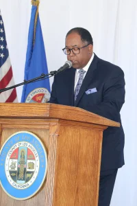 speaker at the podium at the 2019 John Anson awards ceremony.