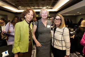 3 women smiling.