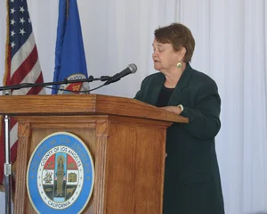 speaker at the podium at the 2019 John Anson awards ceremony.