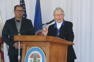 speaker at the podium at the 2019 John Anson awards ceremony.