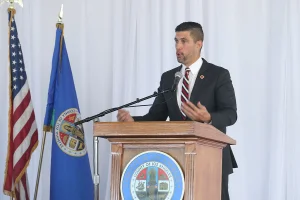 speaker at the podium at the 2019 John Anson awards ceremony.