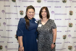 2 women smiling.
