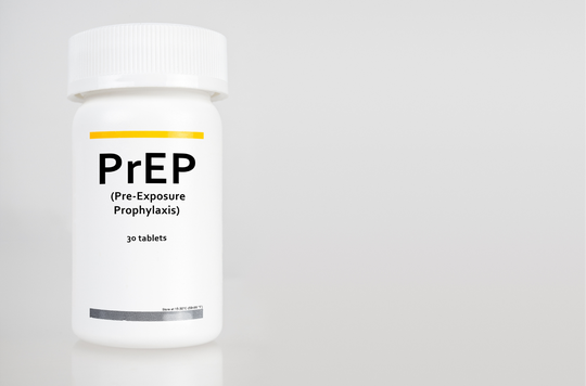 A white pill bottle with a ribbed white cap stands against a light gray background; a yellow horizontal line appears near the top of the label above bold black text reading 'PrEP', followed by smaller text '(Pre-Exposure Prophylaxis)', and below that '30 tablets'; very small text near the bottom reads 'Store at 15-30°C (59-86°F)'; the bottle casts a faint shadow on the surface.