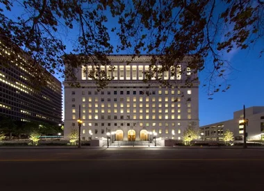 Building with lights on at night.