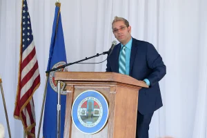 speaker at the podium at the 2019 John Anson awards ceremony.