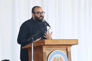 speaker at the podium at the 2019 John Anson awards ceremony.