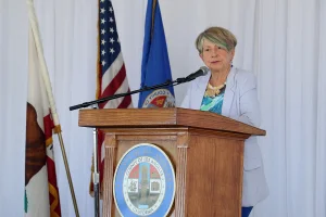 speaker at the podium at the 2019 John Anson awards ceremony.