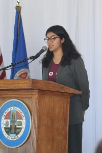 speaker at the podium at the 2019 John Anson awards ceremony.