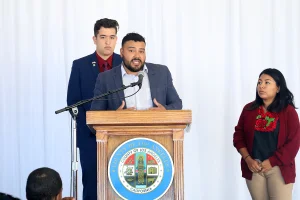 speaker at the podium at the 2019 John Anson awards ceremony.