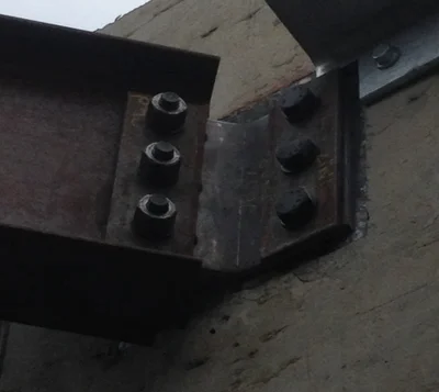 Bent plate connected to a embedded plate