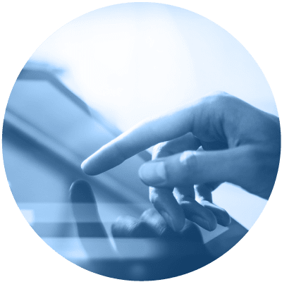 someone touching a computer screen, zoomed in on the person's hand, to show that digital transformation is number 7 on the list of hot leadership topics for 2021