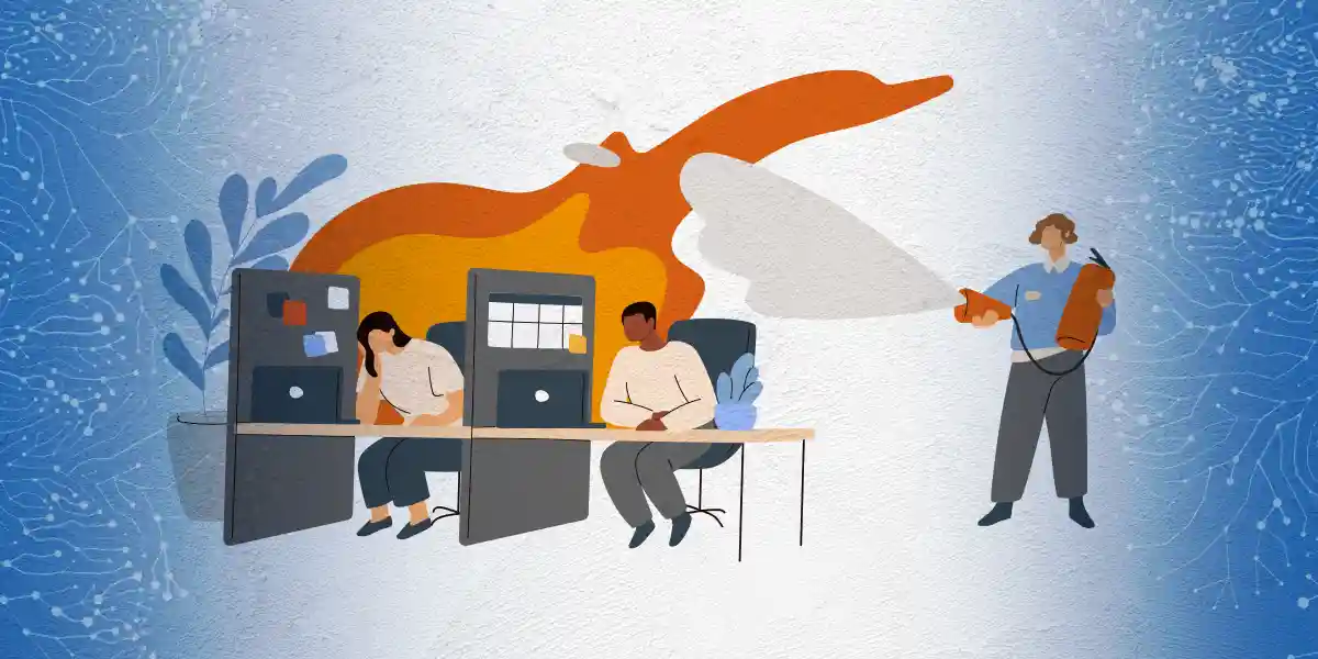 Two people in cubicles with flames behind them because they are feeling burn out. A person to the side is trying to extinguish the flames.