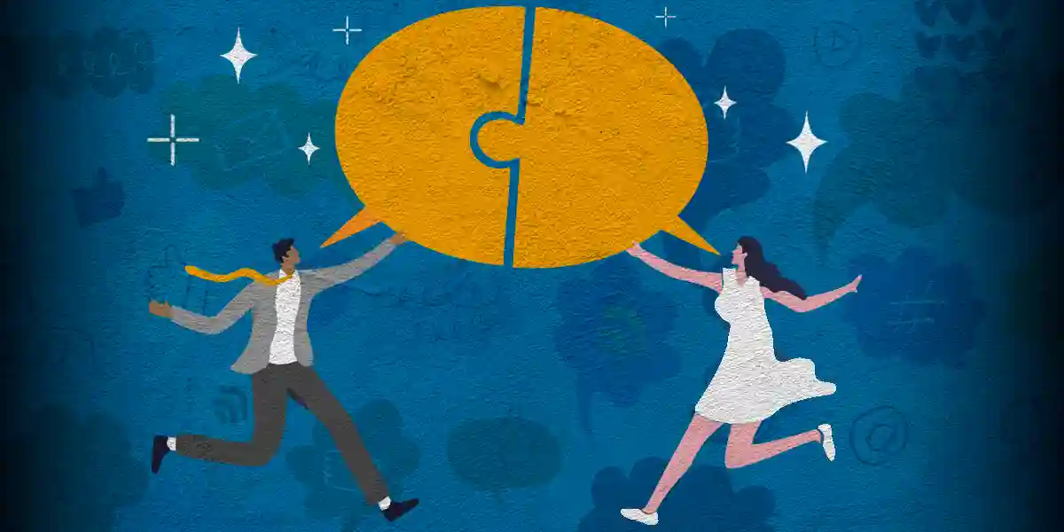two people holding up a shared chat bubble that's split into two puzzle pieces