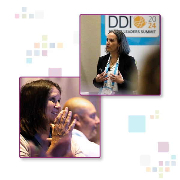 Better Leaders Summit 2024 recap of DDI client presenting and another client clapping