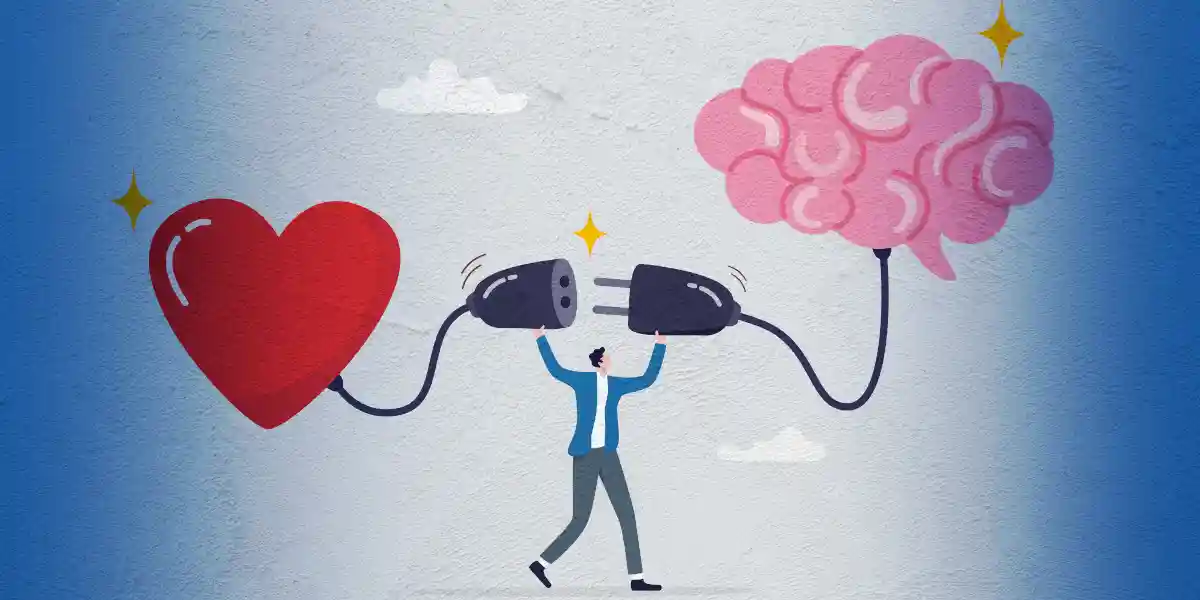 An illustrated man in business attire trying to plug together a heart and a brain to represent emotional intelligence in leadership.