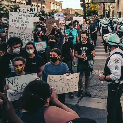 people with masks on protesting social inequality