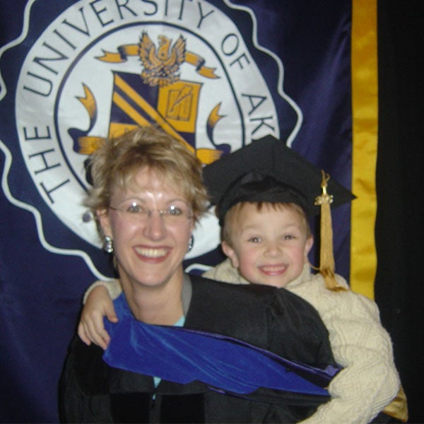 Tacy Byham and her son on the day she graduated with her Ph.D., a big milestone on her leadership journey