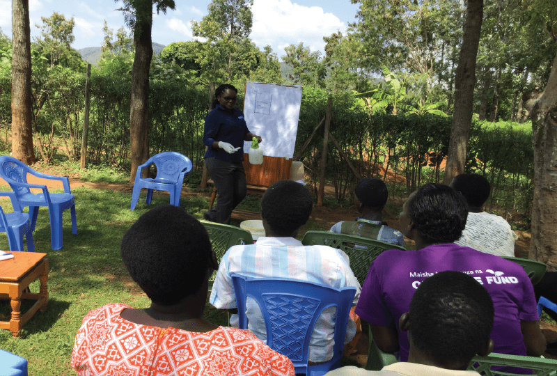 a person doing a demonstration in front of a group of people