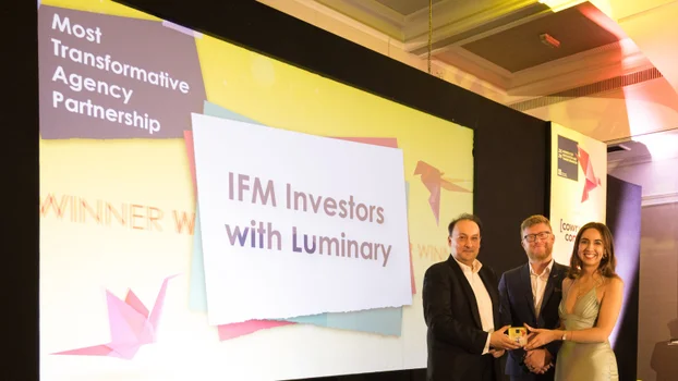 Picture of IFM accepting the award for Most Transformative Agency Partnership