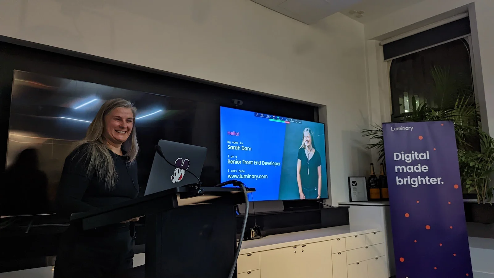 Sarah presenting at the lecturn