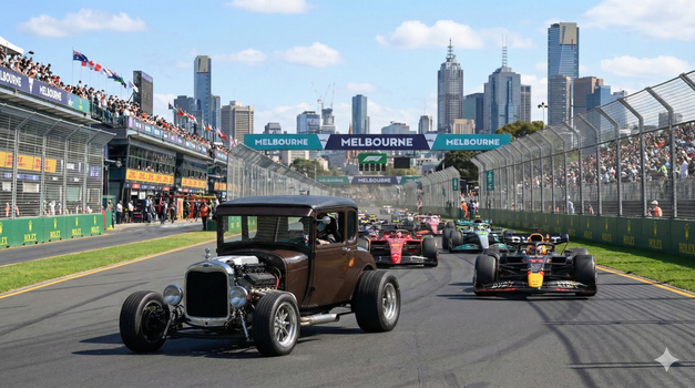 A Formula 1 race with a Model T ford in the lead