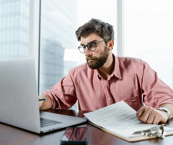 man looking at a lapotop screen