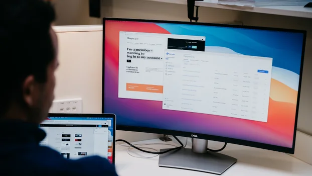 A Luminary project on Optimizely - two screens with man looking at screens