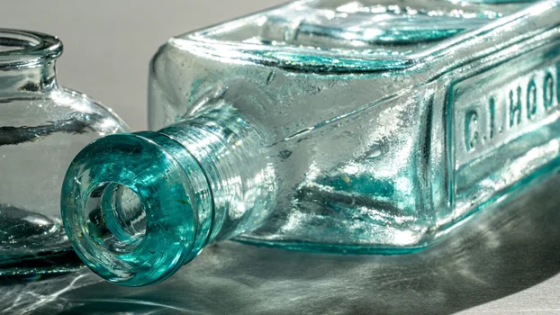 Clear blue bottle lying down