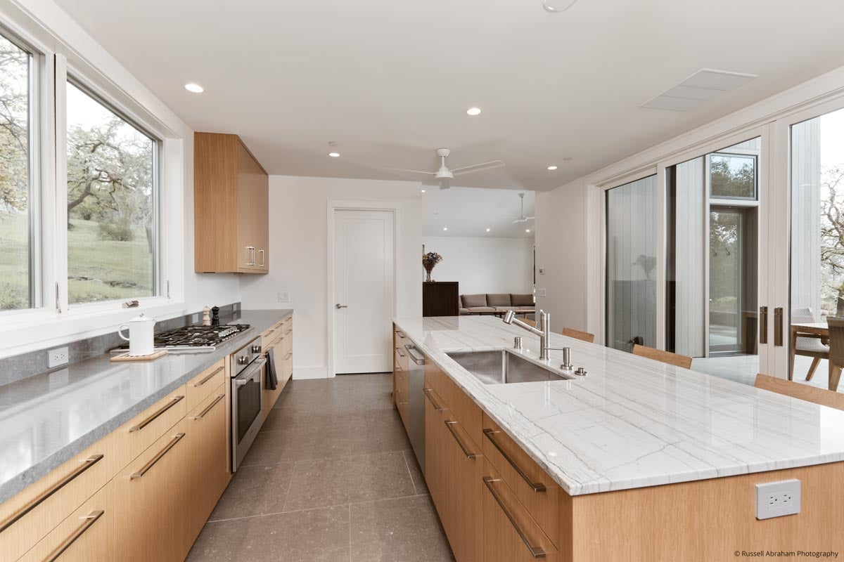 AM230 - Kolbe VistaLuxe WD awnings and sliding patio door featured in guest house kitchen 