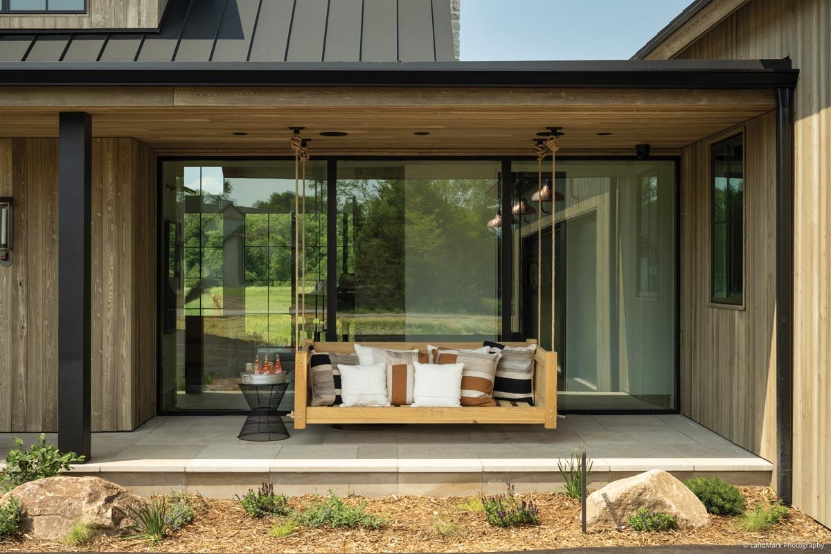 AN305 - porch swing in front of large VistaLuxe Collection windows