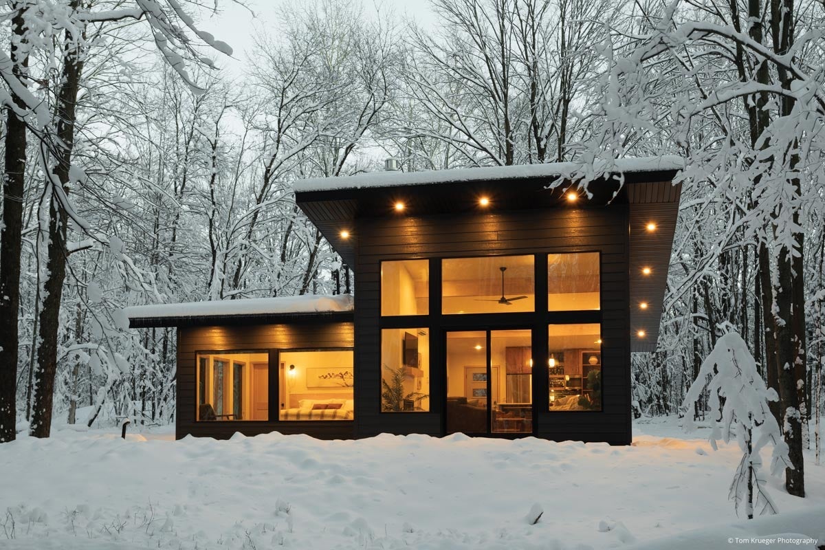 AM301 - exterior of home with floor to ceiling direct set windows and sliding patio door