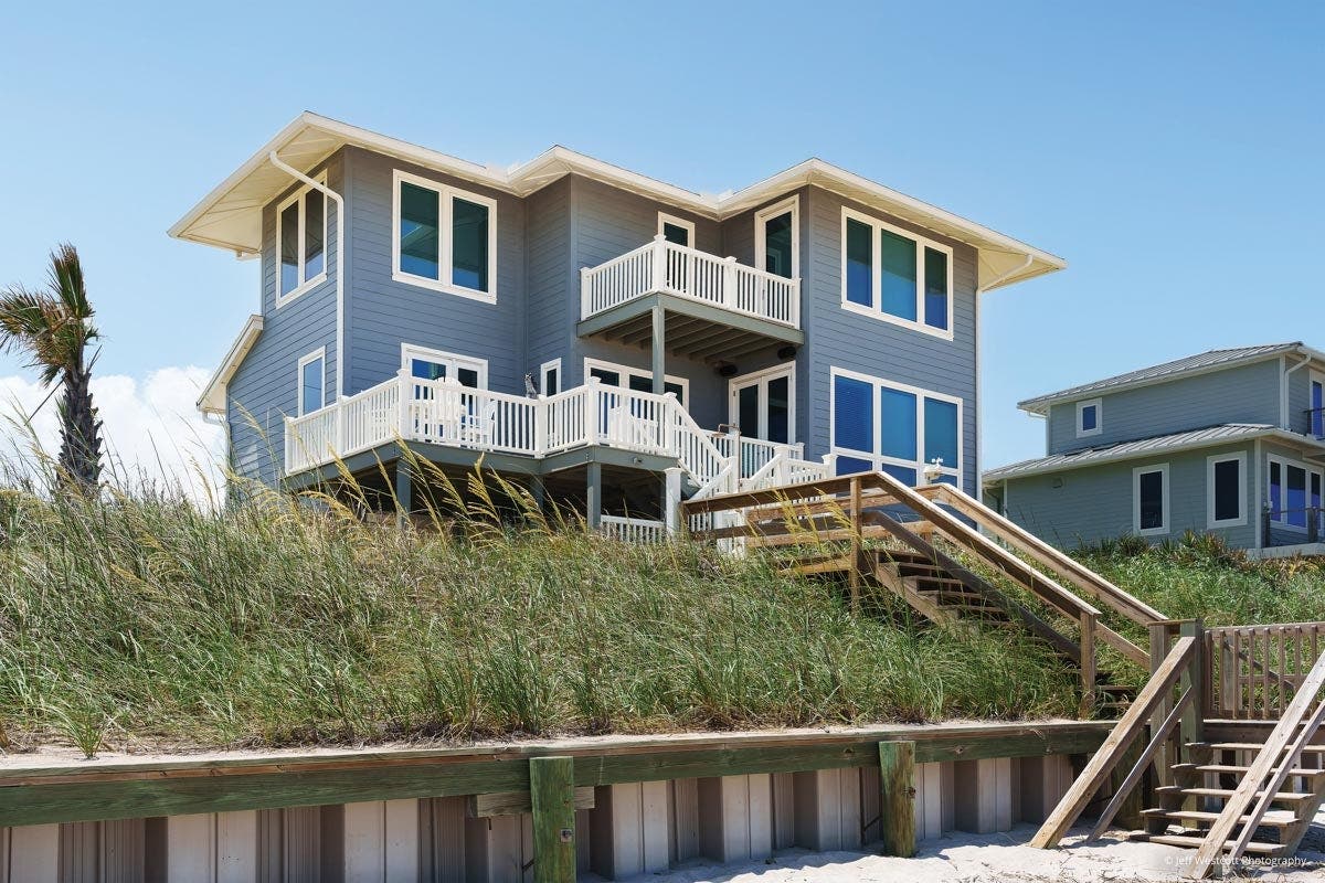 AM904 - exterior view of beach home with multiple Forgent windows