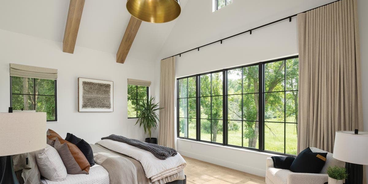 AN326 - bedroom with tall ceiling, wood beams and VistaLuxe Collection windows