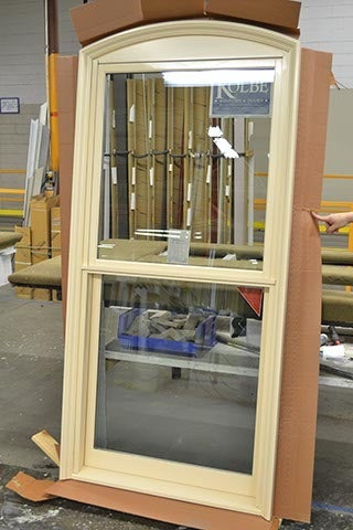 CS37-4, Double Hung with Simulated Segment Head & Custom Casing (exterior)