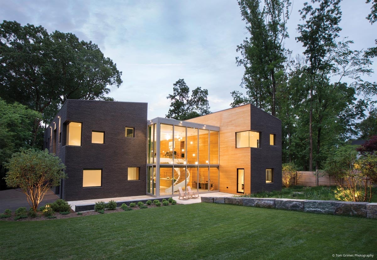 AN100 - exterior view of large home with multiple VistaLuxe WD direct sets and large glass wall