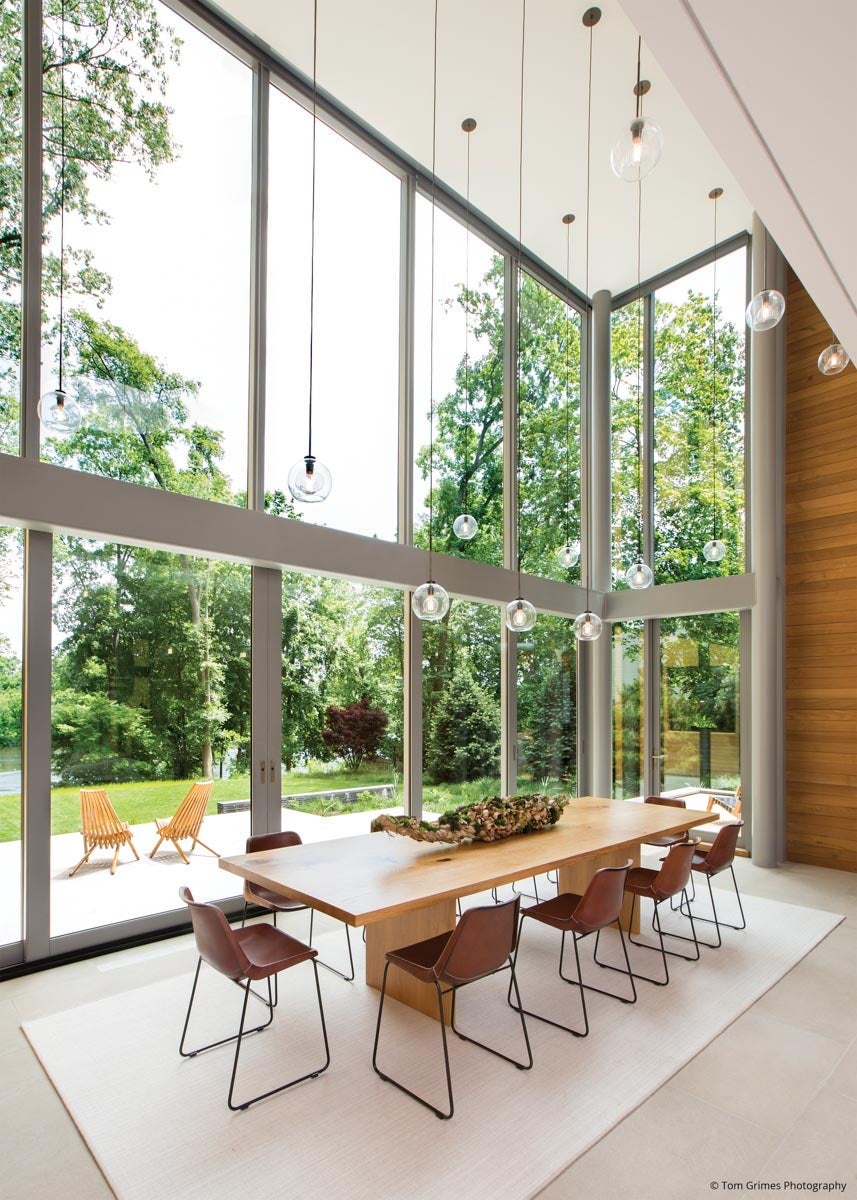 AN105 - dining room with two story glass wall including a lift and slide door 