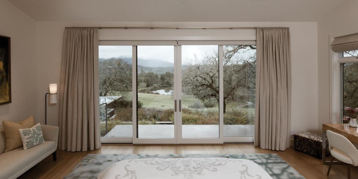 AM224 - Kolbe VistaLuxe WD sliding patio door featured in main bedroom