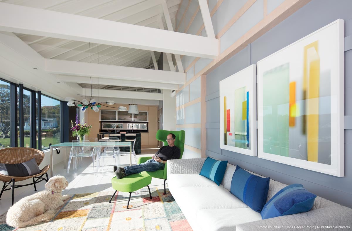 windows and doors with large expanses of glass to a home brightens the space and minimizes the need for light fixtures