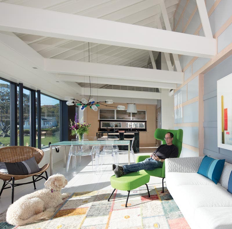 windows and doors with large expanses of glass to a home brightens the space and minimizes the need for light fixtures