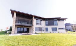 AM405 - back of house with Ultra series sliding door and multiple Forgent series windows