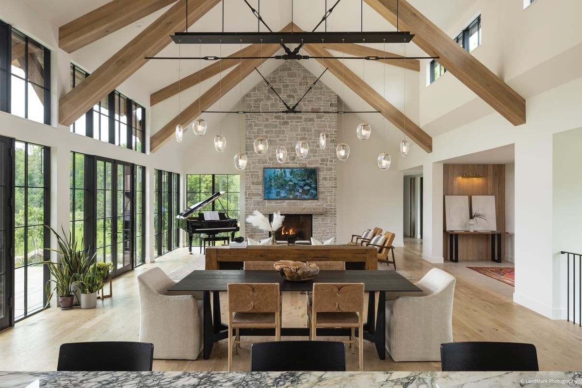 AN319 - living room with high ceilings and wood beams; VistaLuxe Collection windows and door