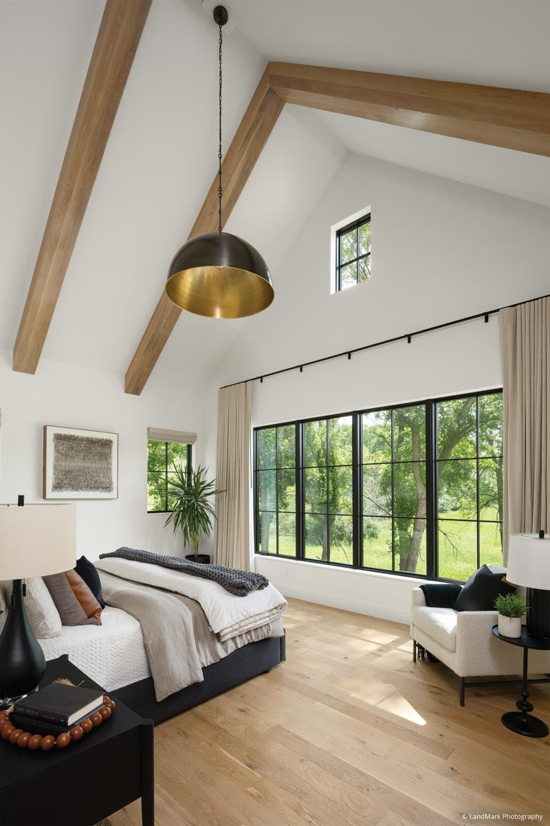 AN327 - bedroom with tall ceiling, wood beams and VistaLuxe Collection windows