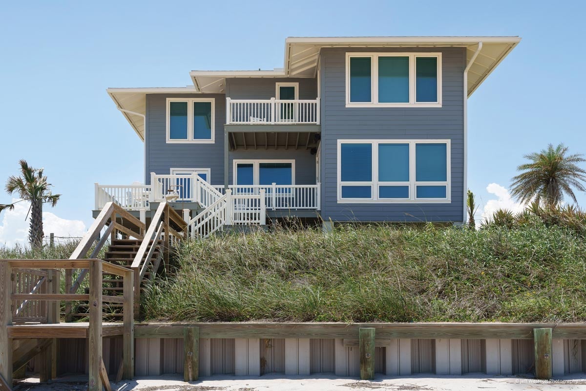 AM903 - exterior view of beach home with multiple Forgent windows