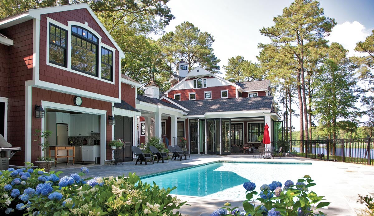 exterior view of home with pool and ultra series sterling double hung, folding door, crank-out awning and double hung transom